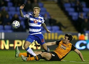 Images Dated 19th April 2016: Battle for the Ball: Rakels vs. Maguire - Sky Bet Championship Showdown at Reading's Madejski