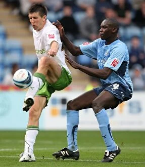 Images Dated 31st October 2009: Battle for the Ball: Rasiak vs. Grandison in the Intense Championship Clash between Coventry City