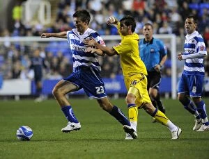 Images Dated 16th September 2009: Battle for the Ball: Rasiak vs. Ledley - Championship Showdown between Reading and Cardiff City