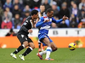 Images Dated 27th October 2012: Battle for the Ball: Reading vs Fulham, Premier League - Intense Rivalry at Madejski Stadium