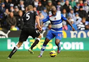Images Dated 27th October 2012: Battle for the Ball: Roberts vs. Hangeland - Reading vs. Fulham, Premier League Rivalry