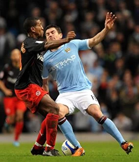 Images Dated 14th March 2011: Battle for the FA Cup: Leigertwood vs. Kolarov - A Football Rivalry Unfolds