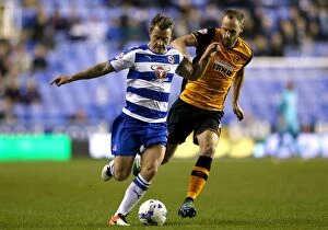 Images Dated 19th April 2016: Battle for Supremacy: Reading's Simon Cox vs. Hull City's David Meyler in Sky Bet Championship