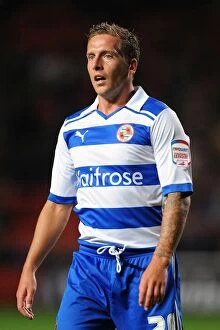 Images Dated 23rd August 2011: Brian Howard's Determined Performance: Reading FC Advances Past Charlton Athletic in Carling Cup