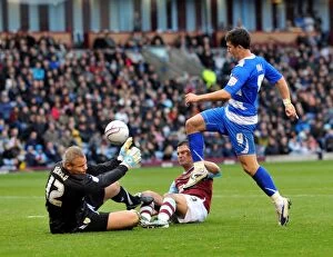 Images Dated 23rd October 2010: Burnley's Unbeatable Duo: Jensen and Fox Deny Shane Long's Reading Threat at Turf Moor