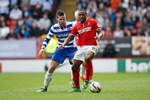 Images Dated 5th April 2014: Charlton's Harriott Clashes with Reading's Guthrie in Sky Bet Championship Match