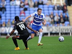 Images Dated 25th October 2014: Chris Gunter vs. Nathan Delfouneso: A Football Rivalry Unfolds at the Madejski Stadium - Reading