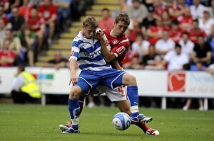 Images Dated 8th August 2009: Church vs. Chambers: A Championship Showdown - Intense Battle for Ball Supremacy at Reading's