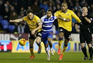 Images Dated 17th February 2015: A Clash of Midfield Maestros: Williams vs. Kvist and Clarke (Reading vs)