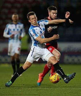 Images Dated 24th February 2015: Clash of Midfield Titans: Huddersfield's Jonathan Hogg vs. Reading's Danny Guthrie in Sky Bet