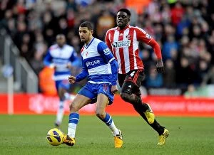 Images Dated 2nd February 2013: Clash of the Midfielders: McAnuff vs. Diaye at Madjeski Stadium (Premier League)