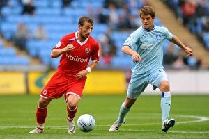 Images Dated 24th September 2011: Clash at Ricoh Arena: A Battle Between Le Fondre and Cranie
