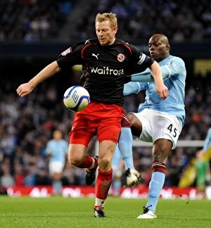 Images Dated 14th March 2011: Clash of Titans: Bryn Gunnarsson vs. Mario Balotelli in the FA Cup Sixth Round - Manchester City
