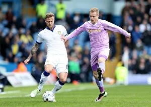 Leeds United v Reading Collection: Cooper vs. Vydra: A Championship Showdown - Intense Rivalry Between Leeds United's Liam Cooper