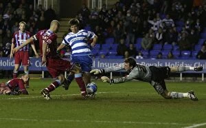 Images Dated 12th December 2009: Determined Duel: Grzegorz Rasiak's Thwarted Effort vs Josh Lillis (Reading FC vs Scunthorpe United)