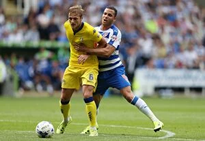 Images Dated 16th August 2015: Intense Battle: Hal Robson-Kanu vs Liam Cooper - Reading FC vs Leeds United, Sky Bet Championship
