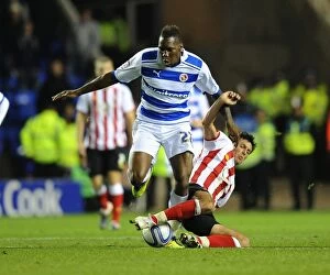 Images Dated 22nd October 2011: Intense Battle: Mathieu Manset vs. Jack Cork in the Championship Clash between Reading