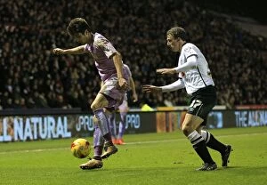 Images Dated 12th January 2016: Intense Battle for Supremacy: Warnock vs. Piazon at iPro Stadium - Derby County vs. Reading