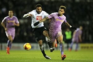 Derby County v Reading Collection: Intense Rivalry: Cyrus Christie vs. Danny Williams Battle at iPro Stadium - Sky Bet Championship