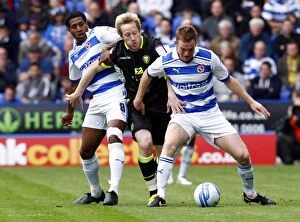 Images Dated 6th April 2012: Intense Rivalry: Leigertwood, Becchio, and Pearce Go Head-to-Head in Reading vs