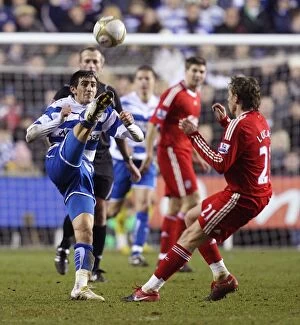 Images Dated 2nd January 2010: Jem Karacan's Epic FA Cup Upset: Sending Leiva Lucas Soaring with a Powerful Kick at Reading's
