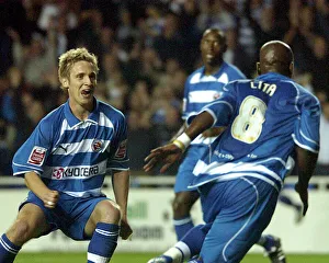 Kevin Doyle runs to meet Leroy Lita