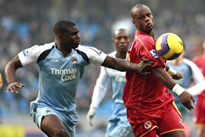 Leroy Lita challenged by Manchester Citys Micah Richards