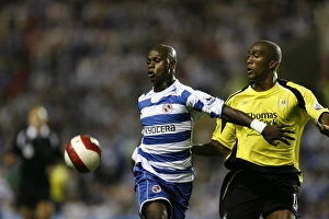 Leroy Lita holds off Sylvain Distin