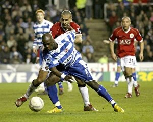 Images Dated 28th February 2007: Leroy Lita takes on Rio Ferdinand in the FA Cup 5th round replay at the Madejski