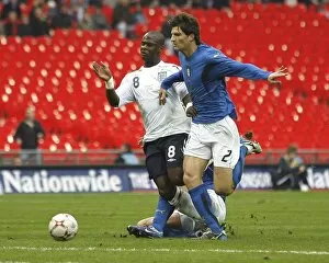Images Dated 26th March 2007: Leroy surges through the Italian defence, challenged by defender Marco Andreolli