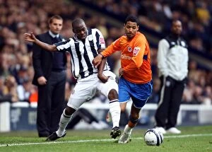 Images Dated 17th October 2009: McAnuff vs. Mulumbu: A Championship Battle – Reading's Jobi McAnuff Faces Off Against West
