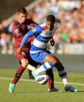 Images Dated 29th September 2012: McCleary vs. Santon: Clash between Reading's Gareth McCleary and Newcastle United's Davide Santon in