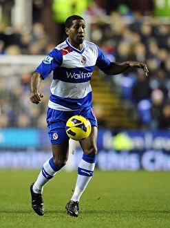 Images Dated 17th December 2012: Mikele Leigertwood of Reading Faces Off Against Arsenal at Madjeski Stadium