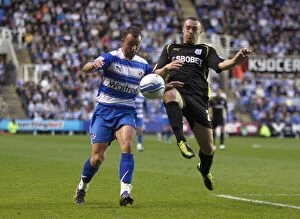 Images Dated 13th May 2011: Noel Hunt vs. Darcy Blake: A Battle in the Npower Championship Play-Off Semi-Final at Madejski