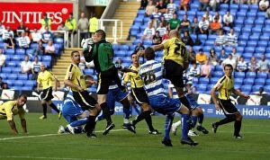 Images Dated 11th August 2009: Poole's Penalty Area Rescue: Chaos in the Carling Cup Clash between Reading and Burton Albion