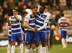 Images Dated 7th February 2015: Reading FC: Alex Pearce and Hope Akpan's Jubilant Championship Victory Celebration at Molineux