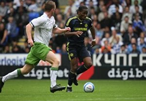 Images Dated 1st August 2009: Reading FC vs. Chelsea: A Pre-Season Rivalry - Didier Drogba's Electric Performance at Madejski
