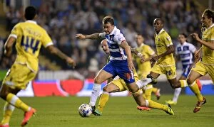 Reading v Millwall Collection: Reading's Simon Cox Goes Head-to-Head with Millwall Defense in Sky Bet Championship Clash at