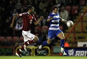 Images Dated 19th October 2010: Thrilling Escape: Noel Hunt Slips Past Liam Fontaine in Npower Championship Showdown at Ashton Gate
